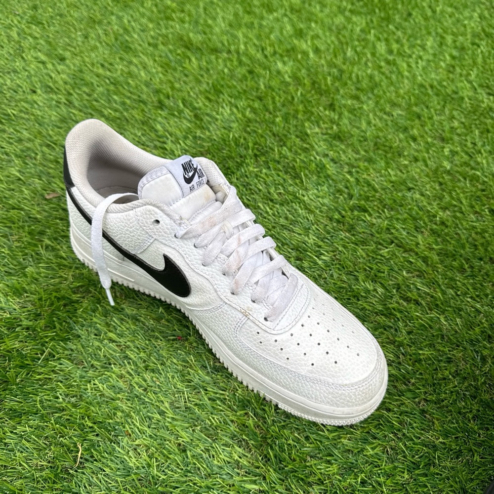 Nike White Low-Top Sneakers with Black Swoosh